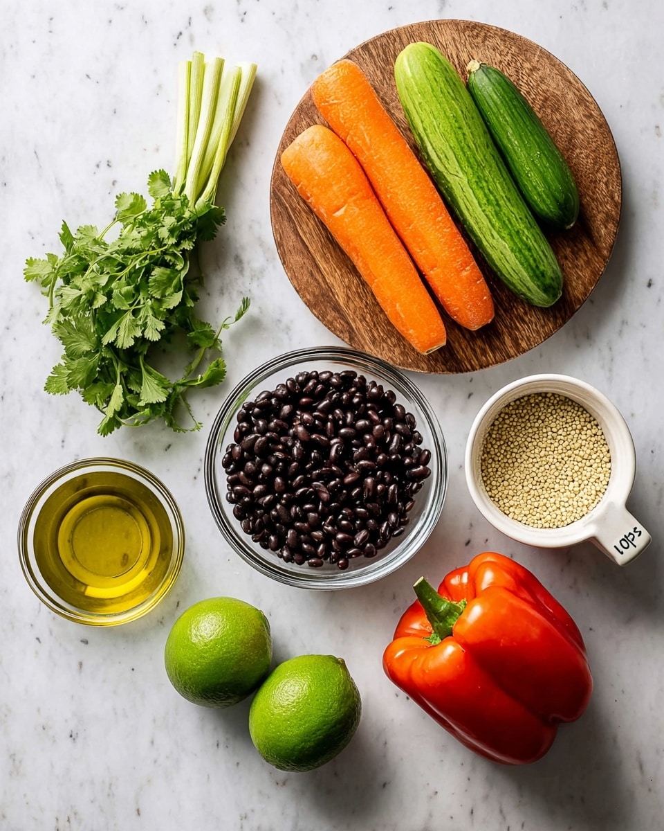 A flat lay image shows fresh ingredients neatly arranged on a white marbled surface. At the top right, a round wooden board holds bright orange carrots, a light green cucumber, fresh green onions, and a bunch of green cilantro leaves. Below the board, there are two whole green limes side by side. Near the center, a clear glass bowl is filled with shiny black beans. To the right of the bowl, a white cup marked