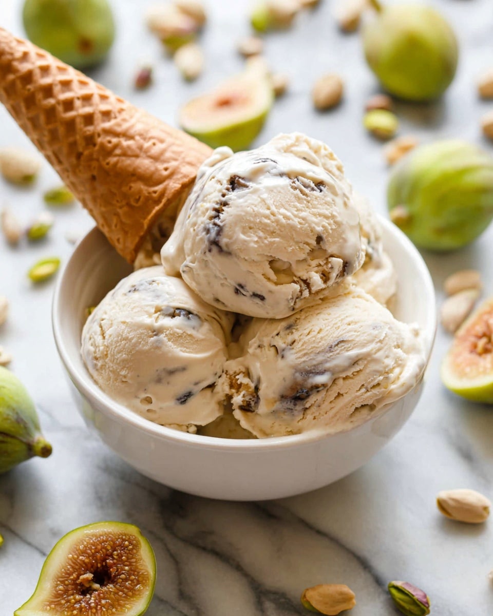A white bowl filled with three scoops of creamy light beige ice cream that has dark swirls and specks throughout, showing texture and flavor variation; a light brown waffle cone is placed upside down, leaning into the ice cream from the left side. The bowl sits on a white marbled surface scattered with whole and halved green figs and some shelled pistachio nuts, creating a fresh and natural setting. The ice cream looks rich and soft, slightly melting around the edges with smooth and swirled textures visible. Photo taken with an iphone --ar 4:5 --v 7