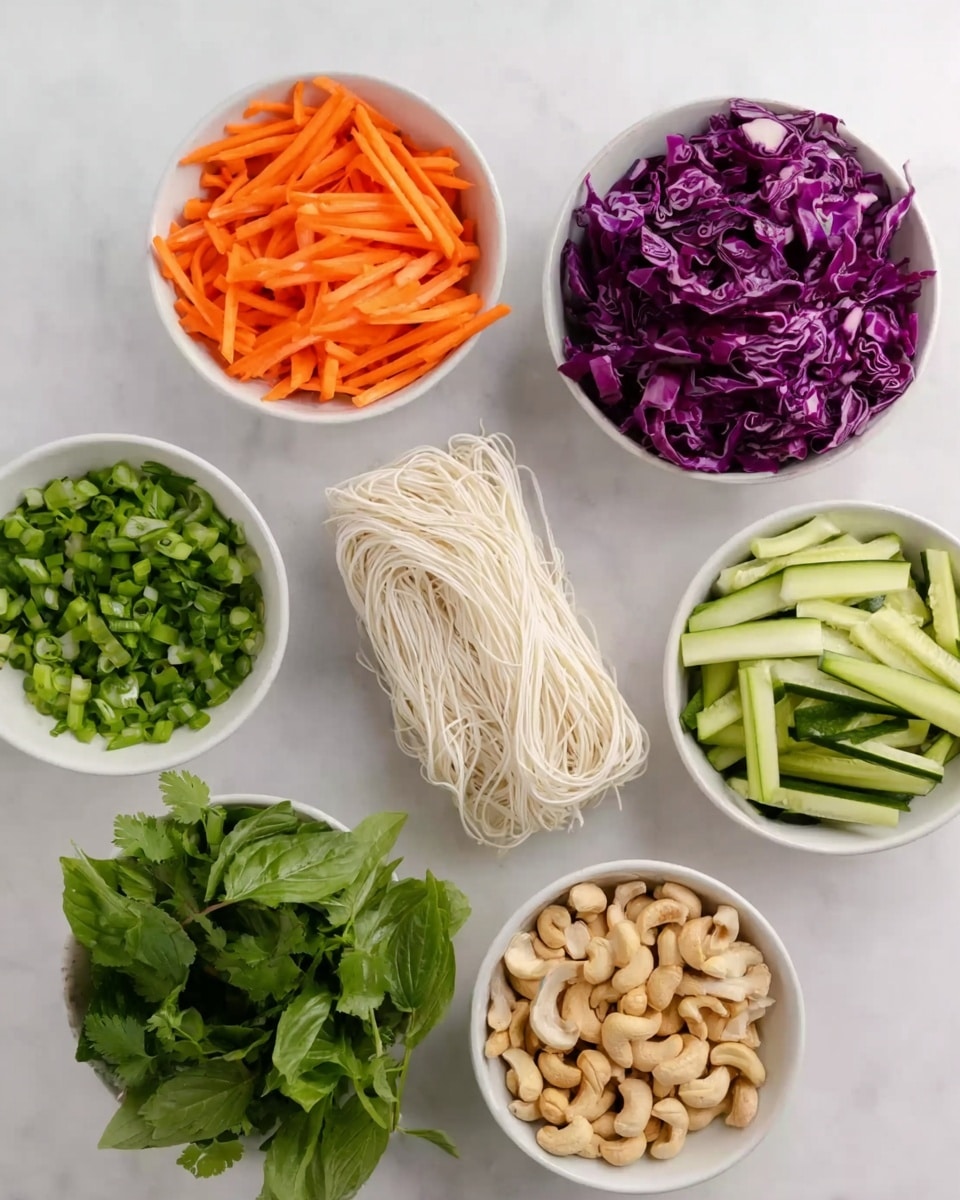 The image shows six white bowls placed on a white marbled surface, each filled with different fresh ingredients. One bowl contains orange carrot sticks cut into thin sticks, another is filled with thinly sliced purple cabbage. There is a bowl with small green chopped onions, another with long slices of green cucumber, and one with light beige cashew nuts. In the center, there is a bundle of thin white noodles arranged neatly on the surface. Some fresh green leafy herbs are placed next to the bowls, adding a fresh touch to the arrangement, photo taken with an iphone --ar 4:5 --v 7