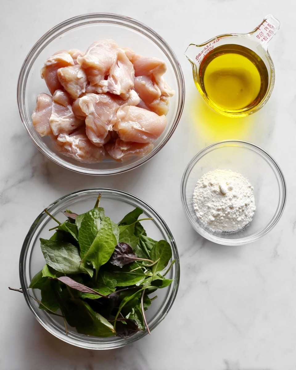 The image shows four clear glass bowls on a white marbled surface. The largest bowl on the left contains raw chicken pieces that are light pink with some white fat bits. To the top right, a measuring cup filled with yellow cooking oil is placed. Next to it, a small bowl holds a fine white powder that looks like flour or starch. At the bottom, there is a bowl filled with fresh dark green leaves, some with a slight purple tint. The setup is neat and simple, all on a smooth white marbled background. photo taken with an iphone --ar 4:5 --v 7