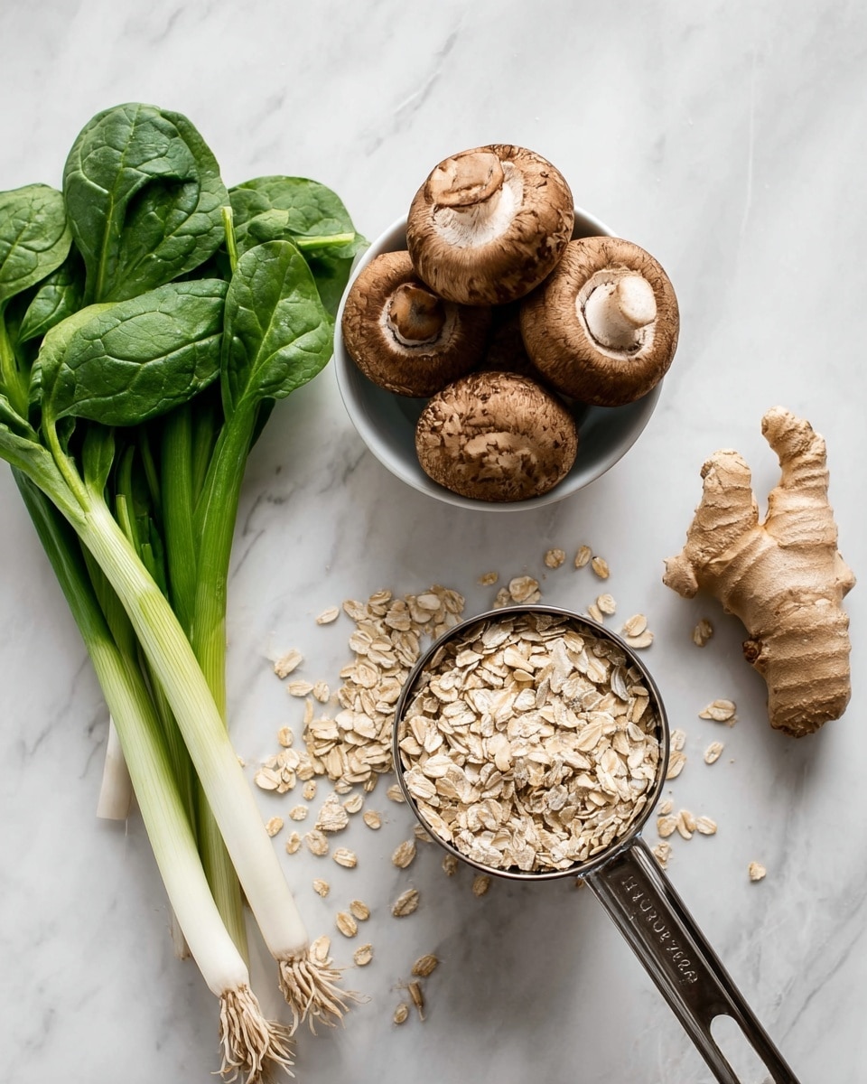 The image shows fresh green spinach leaves on the top left, next to a group of four long green onions with white ends placed diagonally. Below these, a white bowl holds seven brown mushrooms stacked on top of each other. To the right of the mushrooms, a silver metal measuring cup is filled and overflowing with pale beige rolled oats, with some oats scattered on the white marbled surface. A piece of light brown ginger root with textured skin sits to the right of the oats on the same white marbled background. photo taken with an iphone --ar 4:5 --v 7