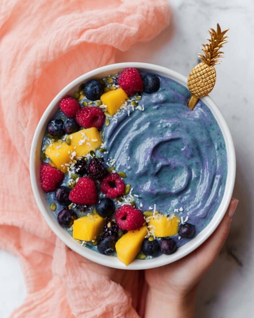 Blue Smoothie Bowl with Blue Spirulina and Tropical Fruit Toppings Recipe