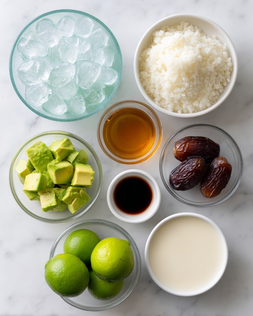 A top view of seven small clear glass and white bowls arranged on a white marbled surface. Starting from top left, a bowl full of ice cubes glistens with a translucent white and blue color. To its right, a white bowl is filled with soft, white cauliflower rice. Below the ice bowl, a small bowl holds a dark brown liquid which is likely vanilla extract. Centered above the lime bowl, another clear bowl contains thick amber-colored honey. On the right side, a bowl with four dark brown dates. Below these, a clear bowl is filled with bright green fresh whole limes. To the bottom left, a clear bowl contains diced light green avocado pieces showing creamy smooth texture. At the bottom right, a white bowl is filled with a creamy white liquid, all on a clean bright white marbled surface. photo taken with an iphone --ar 4:5 --v 7