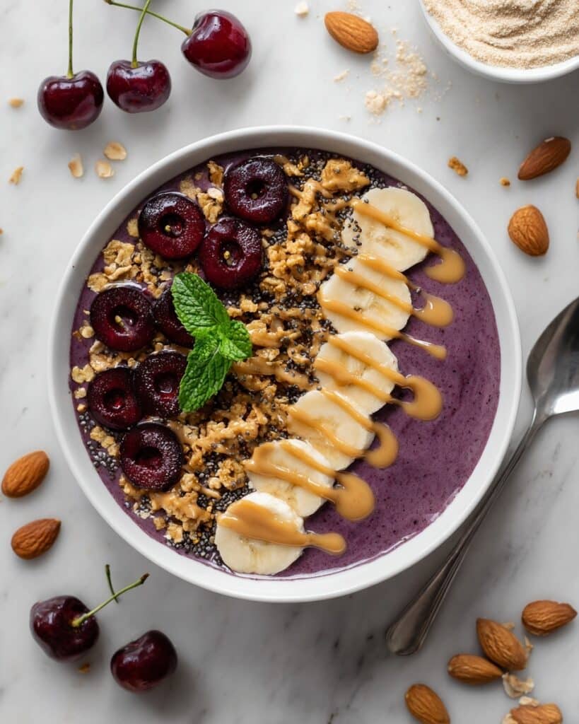 Cherry Smoothie Bowl with Banana, Almond Butter, and Granola Recipe