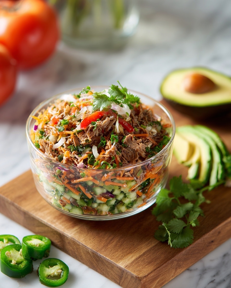 The image shows a clear glass bowl filled with a fresh shredded salad. The top layer has thin pieces of light brown shredded meat, mixed with white onion slices, small bright green herb leaves, and juicy red bell pepper cubes. Below these, there are thin slices of green cucumber and light green celery pieces. The ingredients all look fresh and moist, resting on a white marbled surface. photo taken with an iphone --ar 4:5 --v 7