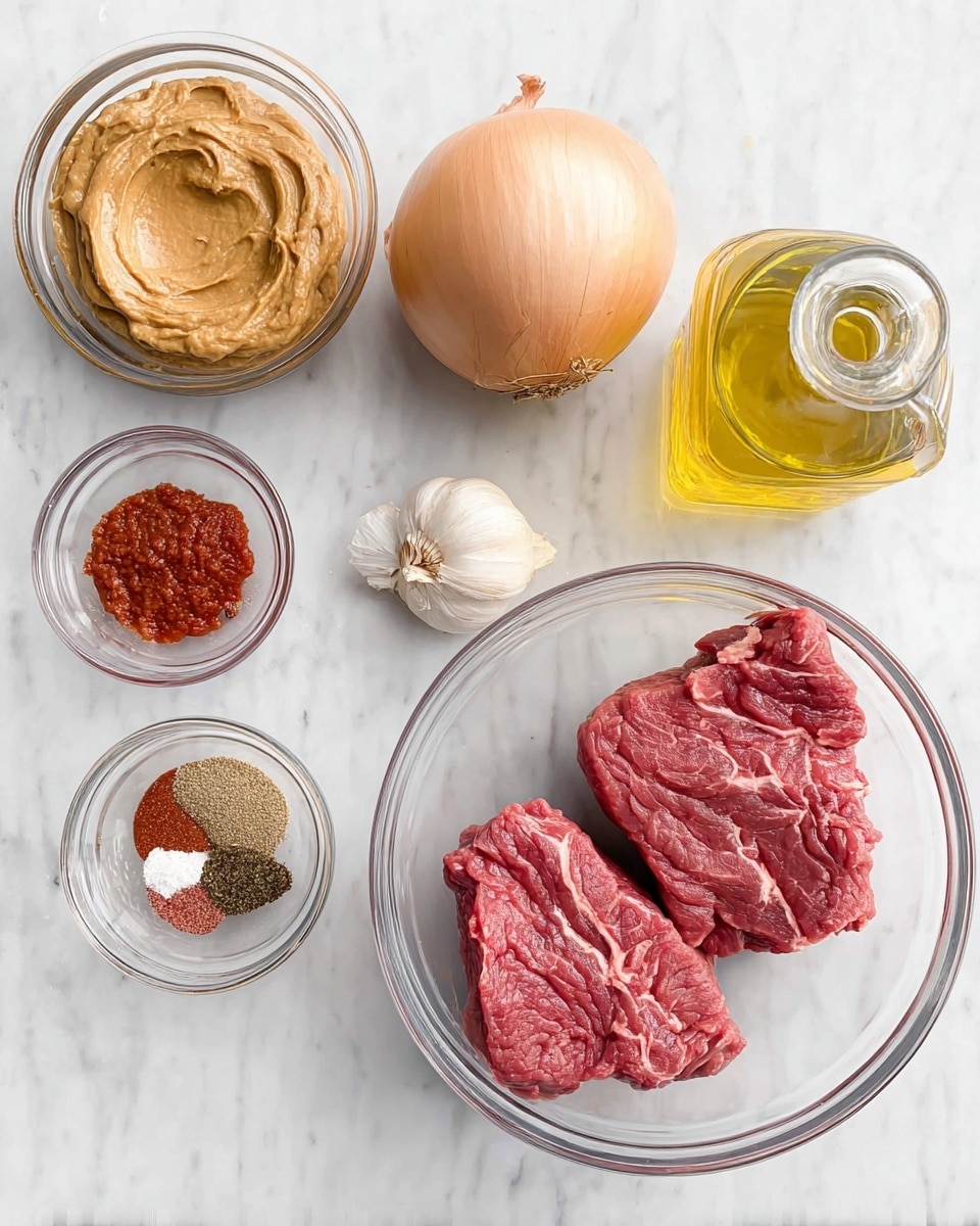 The image shows several clear glass bowls arranged on a white marbled surface. The largest bowl on the right contains two raw pieces of red meat with visible marbling and fat. To its left, there is a smaller bowl filled with tan thick paste. Above this paste bowl is a whole yellow onion with smooth skin. At the top right, there is a clear glass bottle with light yellow oil inside. On the left side of the image, two smaller bowls hold spices: one bowl contains red sauce, likely tomato paste, and the other bowl holds a mix of dry spices in colors like brown, white, and red flakes. The layout is neat and all items are placed in a flat top-down view style. Photo taken with an iphone --ar 4:5 --v 7