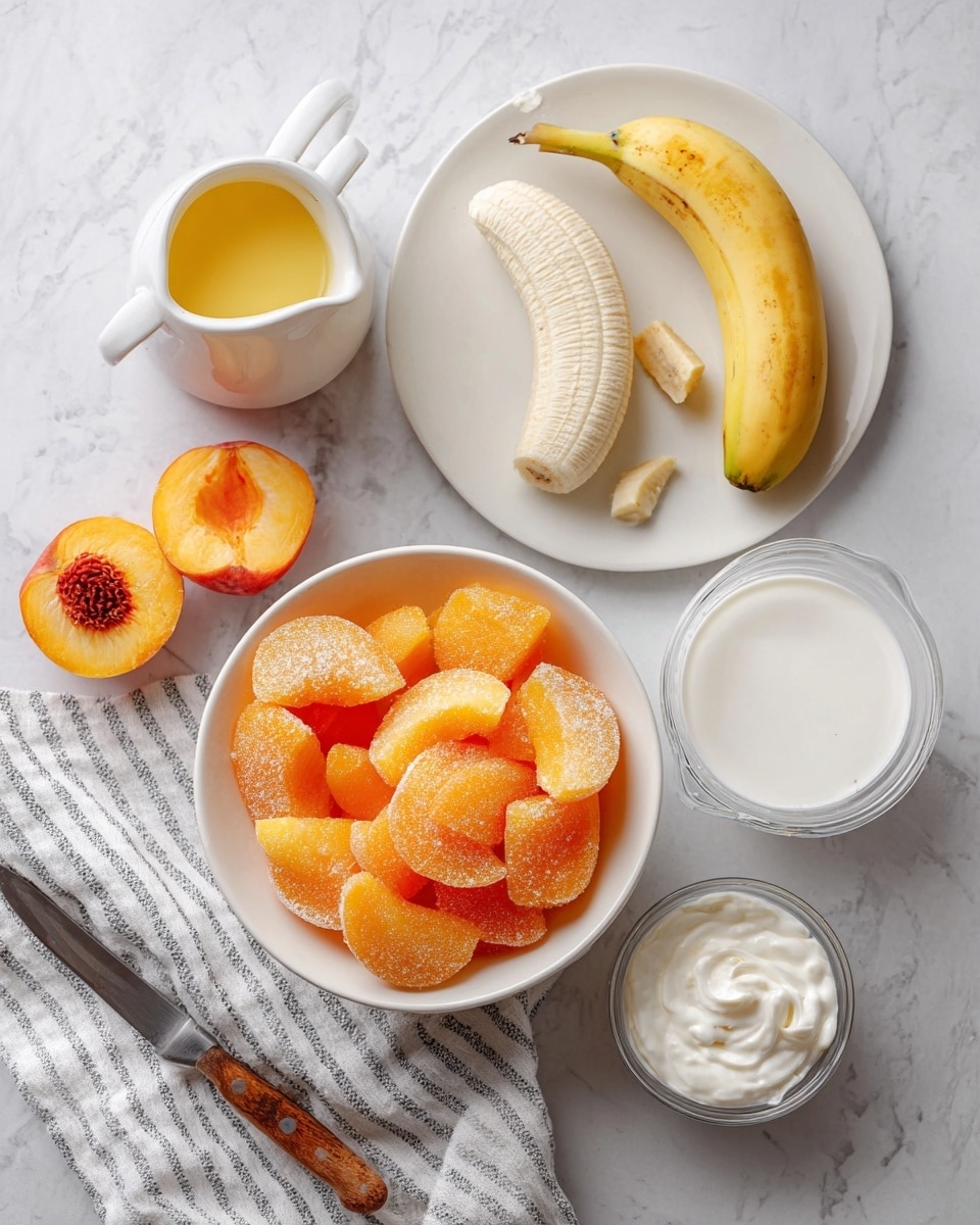 The image shows a white marbled surface with multiple ingredients arranged: in the center, a white bowl filled with many bright orange frozen peach slices, some covered lightly with ice crystals; above to the right, a white plate holding two peeled banana halves side by side with a soft texture; to the top left, a white pitcher with yellow melted butter inside; on the bottom right, a clear measuring cup with white milk and a small white bowl filled with thick white cream; on the bottom left, two peach halves, one showing the pit and the other with a smooth inside, near a knife with a wooden handle; a striped white and black cloth lies near the pitcher. photo taken with an iphone --ar 4:5 --v 7