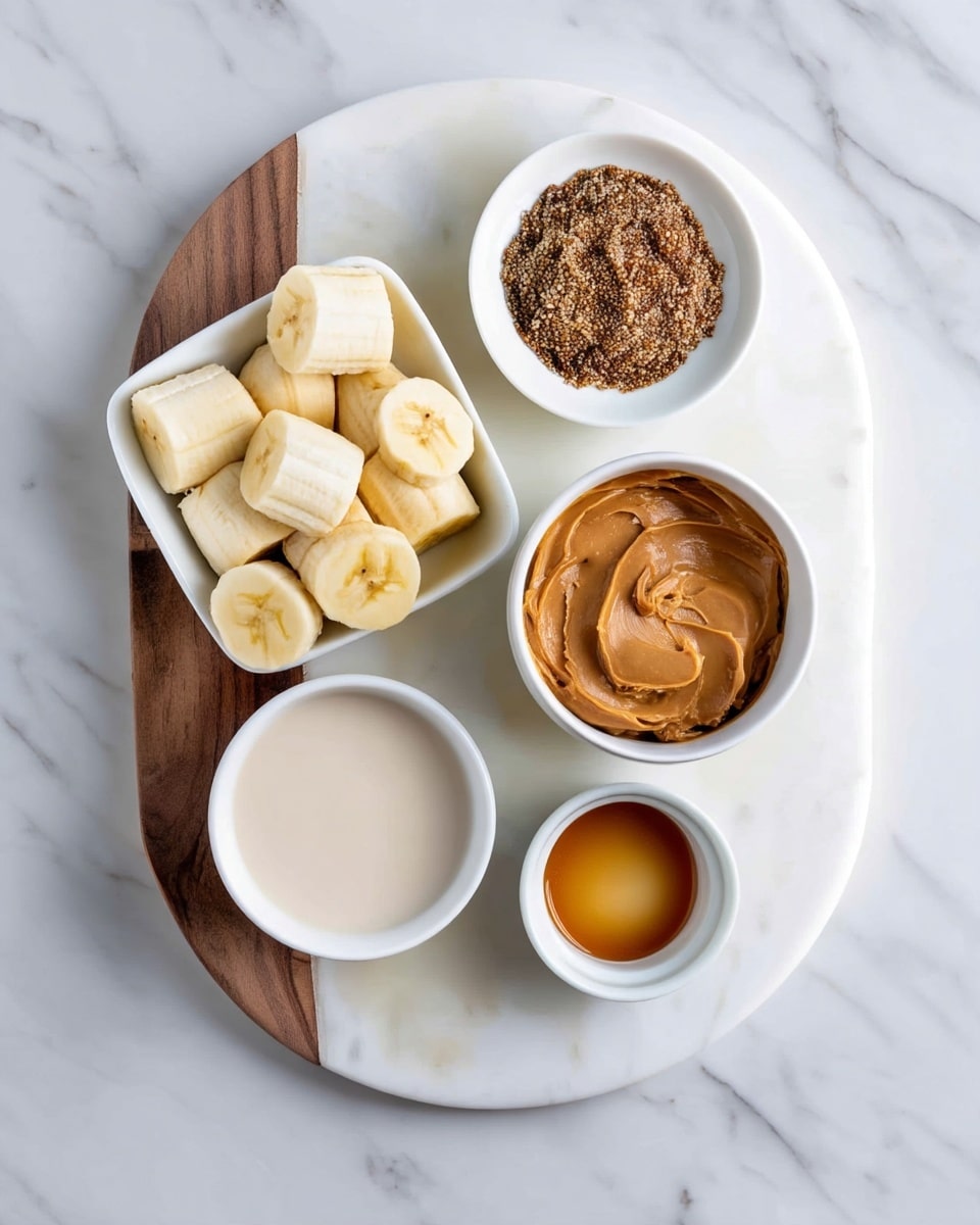 A round white marble board with a wood inlay on the left side holds five white bowls arranged casually. The top left bowl is square and filled with light yellow banana slices showing soft, smooth textures. To its right, a round bowl is full of thick, creamy peanut butter with swirling patterns on the surface in warm brown tones. Below, another round bowl contains coarse, brown ground flaxseeds with a rough texture. At the bottom left, a round bowl holds creamy light beige milk, smooth and shiny. Finally, at the bottom right, a small round bowl contains golden brown liquid honey, glossy and translucent. Photo taken with an iphone --ar 4:5 --v 7